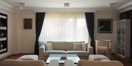 Interior of a modern living room in white.