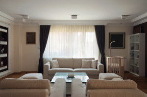 Interior of a modern living room in white.